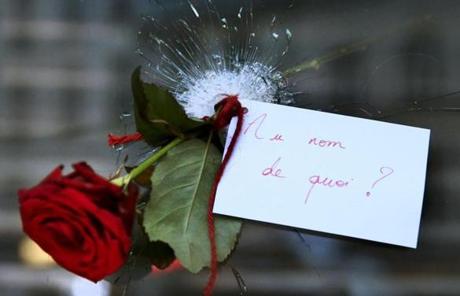 A rose was placed in a bullet hole in a restaurant window the day after a series of deadly attacks in Paris. The note read: 
